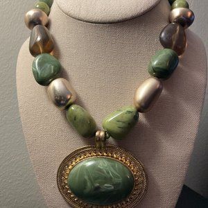 Vintage collar length necklace with large, framed cabochon pendant.